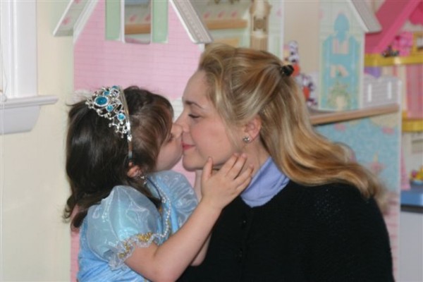Cinderella daughter kissing Mommy