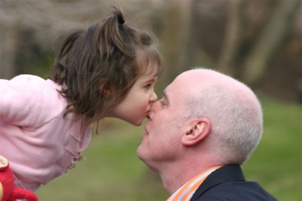 Daughter kissing Daddy