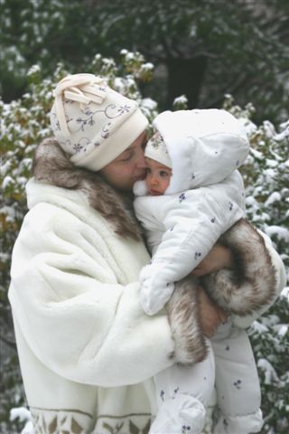 Winter snuggling mom and baby