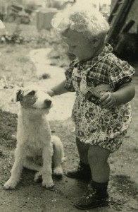 My mom loves animals, sweet dog, darling child, cute curls, love of animals starts young