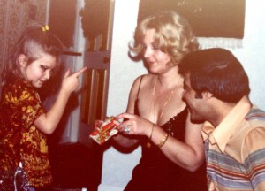 Time for a present, mom opens gift, 1970s, mom dad and sister