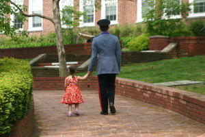 Walking together, hand in hand, red dress, yellow flowers