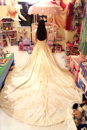 10 year old tries on Mom's wedding gown (1)
